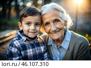 A happy family, a child and a grandmother hug on the street in the park, happy and contented. A grandmother who hugs her grandson, showing love. Стоковое AI-изображение, AI-художник Photojuli / Фотобанк Лори