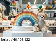 Beautiful colorful showcase of a children's store with a rainbow and a teddy bear. The concept of shopping and shopping for children's goods. Стоковое AI-изображение, AI-художник Photojuli / Фотобанк Лори