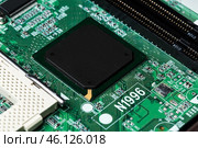 Close up of a printed green computer circuit board. Стоковое фото, фотограф Сергей Толмачёв / Фотобанк Лори