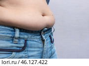Overweight woman, large belly with folds of fat. Стоковое фото, фотограф Коханова Наталья / Фотобанк Лори
