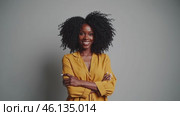 Portrait of a Confident Young Woman Smiling with Folded Arms. Стоковое видео, видеограф Данил Руденко / Фотобанк Лори