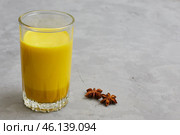 Glass of milk with curcumin, turmeric. Golden milk enhances antiviral protection. Health and antioxidants concept. Coronovirus protection. Стоковое фото, фотограф Кутина Татьяна / Фотобанк Лори