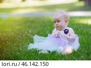 Cute little girl in the grass in summer day. Стоковое фото, фотограф Иван Карпов / Фотобанк Лори