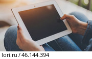 Person using a tablet device. Digital interactions and activities. Man holding a pad. Remote learning, social distance working, ordering buying online, reading e book. Close-Up view, Modern Technology. Стоковое AI-видео, аниматор Марина Демидюк / Фотобанк Лори