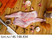 Raw goatling shoulder with rosemary and garlic. Стоковое фото, фотограф Яков Филимонов / Фотобанк Лори