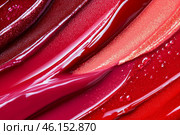 Red liquid lipstick background. Abstract glossy magenta backdrop. Beauty pattern. Smear of lip gloss for design projects. Swatch of saturated fluid blush, tint, rouge. Beauty industry, cosmetics. Стоковое AI-изображение, AI-художник Марина Демидюк / Фотобанк Лори