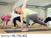 Three women are doing angle pose. Стоковое фото, фотограф Яков Филимонов / Фотобанк Лори