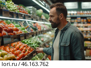 A well-dressed man browses through vibrant displays of fresh vegetables at a supermarket, selecting ripe tomatoes and peppers while enjoying his shopping experience. Стоковое AI-изображение, AI-художник Sergey Grishin / Фотобанк Лори