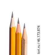 Collection of colored pencils with sharpened tips arranged vertically on a white background for artistic creativity. Стоковое фото, фотограф Сергей Толмачёв / Фотобанк Лори