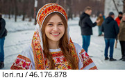 A banner for the Carnival holiday with space to copy. A girl in a traditional costume in close-up at Russian festivities. Стоковое AI-изображение, AI-художник Photojuli / Фотобанк Лори