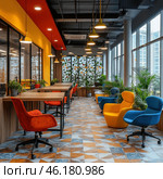 A brightly decorated office or workspace with a modern interior. The room is dominated by bright colors: orange, yellow and blue chairs, which create a positive atmosphere. The space is lit with soft light from hanging lamps, and a bright combination of yellow and red shades can be seen on the walls. Windows open up to views of the city, and plants are located along the walls, which gives the space a cozy and fresh feel. The floor is decorated with colorful tiles with a geometric pattern. This place looks stylish, functional and inspiring for work and rest. Стоковое AI-изображение, AI-художник Анна Кривицкая / Фотобанк Лори