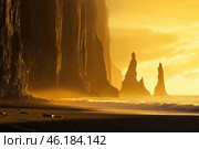 Breathtaking sunset over rocky coastline with formations along the beach. Стоковое AI-изображение, AI-художник Татьяна  Бральнина / Фотобанк Лори