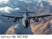 A military aircraft, most likely a bomber, flying over a majestic mountain landscape. The aircraft is dark gray and is seen frontally, with moving engines that emit a bright light. The high snow-capped mountains and clouds in the background emphasize the power and scale of the image, creating a contrast with the technology and nature. Стоковое AI-изображение, AI-художник Анна Кривицкая / Фотобанк Лори