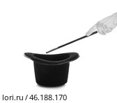 Magician showing trick with hat on white background. Стоковое фото, фотограф Pixel_shot / Фотобанк Лори