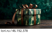 The concept of Defender of the Fatherland Day on February 23. Gift camouflage box with a festive satin ribbon bow on a dark green background. Стоковое AI-изображение, AI-художник Photojuli / Фотобанк Лори