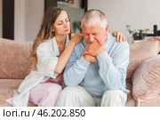Grown up daughter soothe aged father holds his hand feel empathy give him moral support, sad elderly man at home. Стоковое фото, фотограф Гладских Татьяна / Фотобанк Лори