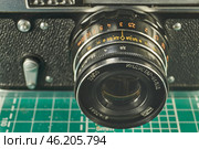 Karachev, Bryansk region Russia - February, 16, 2025: Retro photographic equipment of the USSR – FED-5 rangefinder film camera with an Industar-61L/D lens. Close-up. Virtual Museum of Electronics. Редакционное фото, фотограф Андрей Жигальцов / Фотобанк Лори