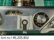 Karachev, Bryansk region Russia - February, 16, 2025: Retro photographic equipment of the USSR – FED-5 rangefinder film camera with an Industar-61L/D lens. Close-up. Virtual Museum of Electronics. Редакционное фото, фотограф Андрей Жигальцов / Фотобанк Лори