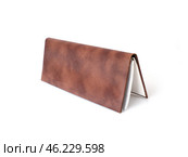Concept diary with brown leather cover isolated on white background. Стоковое фото, фотограф Елена  Попкова / Фотобанк Лори