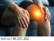Knee pain, joint inflammation, arthritis and degenerative changes, woman suffering from leg ache and doing self-massage. Стоковое AI-изображение, AI-художник Станислав Тарко / Фотобанк Лори