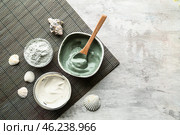 Bowls with cosmetic clays on light table. Стоковое фото, фотограф Pixel_shot / Фотобанк Лори