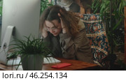 Burnout, writer's block. Tired female employee feels stressed sitting at desk. Стоковое видео, видеограф Маргарита Кирьякова / Фотобанк Лори