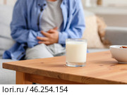 Glass of milk and little boy with dairy allergy at home. Стоковое фото, фотограф Pixel_shot / Фотобанк Лори