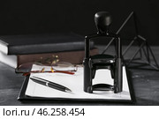 Document, pen and stamp of notary public on table. Стоковое фото, фотограф Pixel_shot / Фотобанк Лори