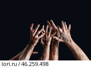 Hands of zombies on dark background. Стоковое фото, фотограф Pixel_shot / Фотобанк Лори