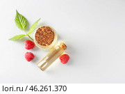 Bottles of raspberry essential oil on light background. Стоковое фото, фотограф Pixel_shot / Фотобанк Лори