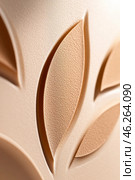 Beige plastic surface with embossed leaf pattern creating intriguing texture. Стоковое AI-изображение, AI-художник Юрий Поздников / Фотобанк Лори