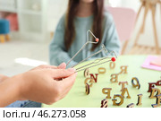 Female speech therapist with logopedic probes in office, closeup. Стоковое фото, фотограф Pixel_shot / Фотобанк Лори