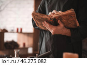 Male alchemist with spell book in laboratory, closeup. Стоковое фото, фотограф Pixel_shot / Фотобанк Лори