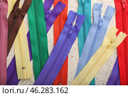 Stylish different zippers on light background, closeup. Стоковое фото, фотограф Pixel_shot / Фотобанк Лори