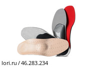 Different orthopedic insoles on white background. Стоковое фото, фотограф Pixel_shot / Фотобанк Лори