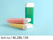 Liposoluble wax cartridges on color background. Стоковое фото, фотограф Pixel_shot / Фотобанк Лори