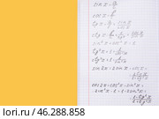Copybook with maths formulas on yellow background. Стоковое фото, фотограф Pixel_shot / Фотобанк Лори