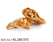 Halves of baked meat empanada on white background. Стоковое фото, фотограф Pixel_shot / Фотобанк Лори