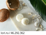 Board with tasty coconut mochi on table. Стоковое фото, фотограф Pixel_shot / Фотобанк Лори