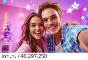 A happy young couple takes a selfie against the backdrop of bright garlands and sparkling snowflakes, conveying an atmosphere of joy, coziness and festive mood. Стоковое AI-изображение, AI-художник ArtVladZ / Фотобанк Лори