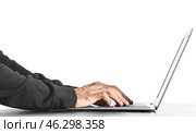 Professional hacker using laptop at table against white background. Стоковое фото, фотограф Pixel_shot / Фотобанк Лори
