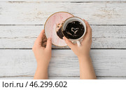 Woman reading coffee grounds at table. Стоковое фото, фотограф Pixel_shot / Фотобанк Лори