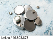 Lithium button cell batteries on light background, closeup. Стоковое фото, фотограф Pixel_shot / Фотобанк Лори