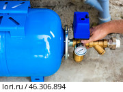 Installation of a water supply station to a residential building using a hydraulic accumulator. Стоковое фото, фотограф Коханова Наталья / Фотобанк Лори
