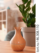 Aroma oil diffuser on table in room. Стоковое фото, фотограф Pixel_shot / Фотобанк Лори