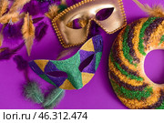 Festive cake for Mardi Gras (Fat Tuesday) holiday with decor on color background. Стоковое фото, фотограф Pixel_shot / Фотобанк Лори