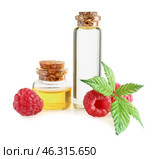 Bottles of raspberry essential oil on white background. Стоковое фото, фотограф Pixel_shot / Фотобанк Лори
