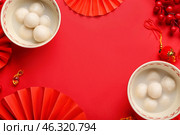 Frame made of bowls with tangyuan and Chinese decor on red background. Dongzhi Festival. Стоковое фото, фотограф Pixel_shot / Фотобанк Лори
