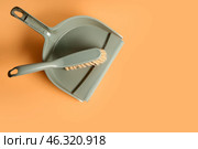 Plastic dustpan with brush on color background. Стоковое фото, фотограф Pixel_shot / Фотобанк Лори