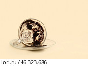 Cup with spent coffee grounds for fortune telling on color background. Стоковое фото, фотограф Pixel_shot / Фотобанк Лори